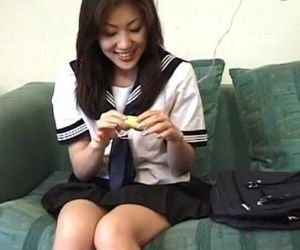 Shy jap doll in school uniform trying vibrators on her pussy
